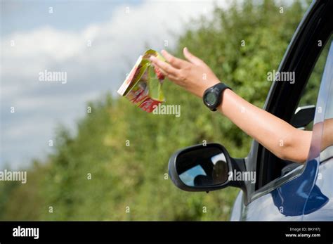 Somebody Throwing Litter Out Of A Car Window Stock Photo Alamy