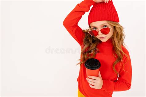 Portrait Of A Girl With A Red Hat And Sunglasses With A Glass On A