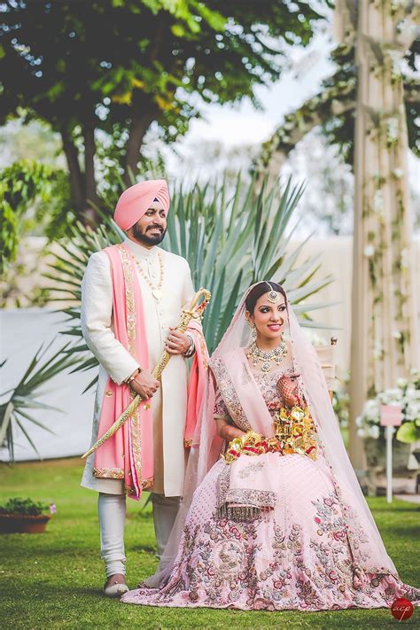 Kamu dapat memadukan lace dress dengan. Punjabi bride and groom in coordinated pink Dolly J wedding lehenga and sherwani. #Frugal2Fab ...