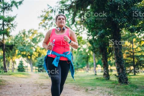 Young Overweight Woman Running Stock Photo Download Image Now