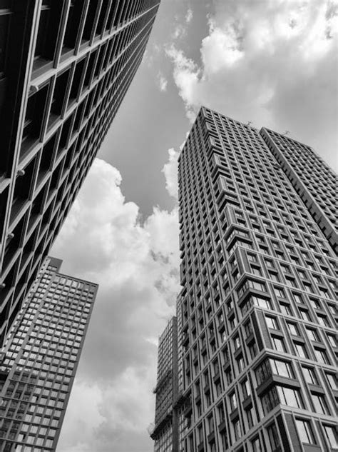 Grayscale Photo Of High Rise Buildings In The City · Free Stock Photo