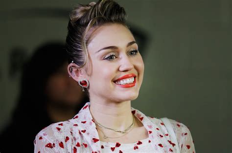 Miley Cyrus Rocks A Green Good Luck Bear Onesie For St Patricks Day