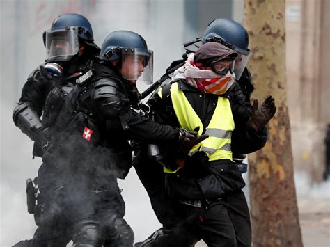 paris protests eiffel tower reopens as hundreds of activists remain in police custody the