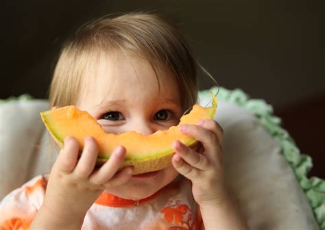 bigstock-Baby-eating-cantaloupe-fruit-9939953 - Day 2 Day Parenting
