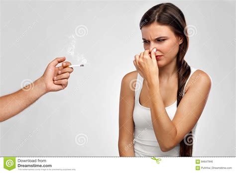 Smoking Beautiful Woman Holding Nose Smelling Cigarette