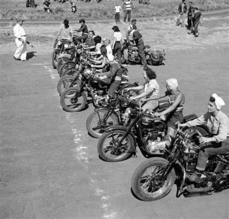 Black And White Photograph Of People Riding Motorcycles In A Row On The