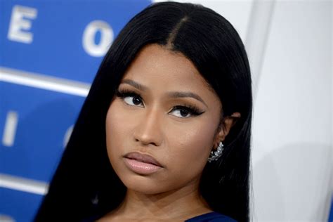 Nicki Minajs Plunging Jumpsuit Logo Bralette And Sandals Are So Chic
