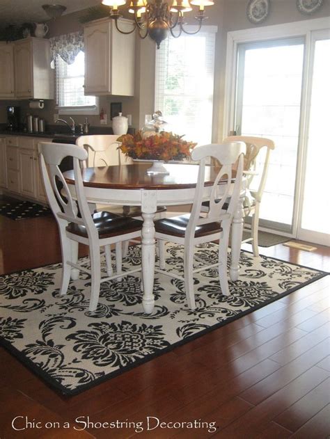 An Expert Explains How Adding A Rug Under Your Dining Room Table Can