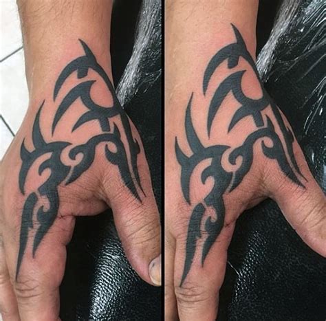 Take the hand tattoo to the next level with a skull tattoo design. 40 Tribal Hand Tattoos For Men - Manly Ink Design Ideas