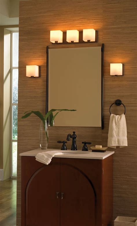 The sink may or may not have a vanity cabinet surrounding it, and the mirror might be installed against the wall or part of a functional medicine cabinet; retro Bathroom vanity lighting ideas