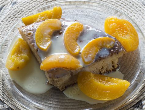 Sweet Cake With Condensed Milk And Peaches Stock Photo And Royalty