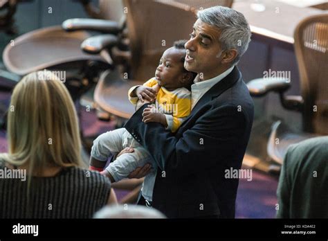 London Uk 12th Oct 2017 Mayor Of London Sadiq Khan Holds The Son Of