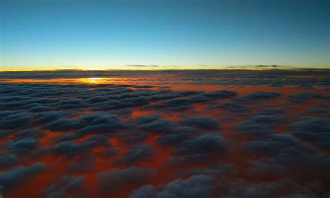 1366x768 sunset above clouds laptop hd hd 4k wallpapers images backgrounds photos and pictures