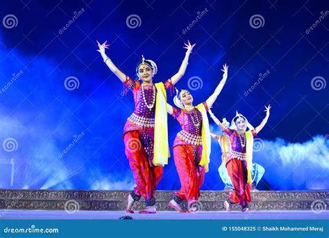 Group Of Classical Odissi Dancers Performing Odissi Dance On Stage At