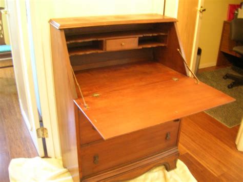 If you live in a cramped apartment, you can use yours as a compact workspace. secretary or writing desk with fold-down desk and 2 ...