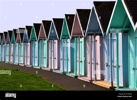 Multi Coloured Beach Huts Used For Changing On The Beach In England