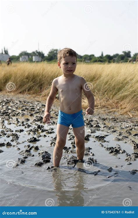 Boy Standing In The Healing Mud Royalty Free Stock Photography