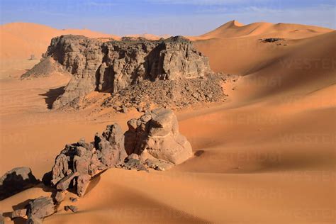 Algeria Sahara Desert Sand Dunes And Rock Towers At Ouan Zaouatan