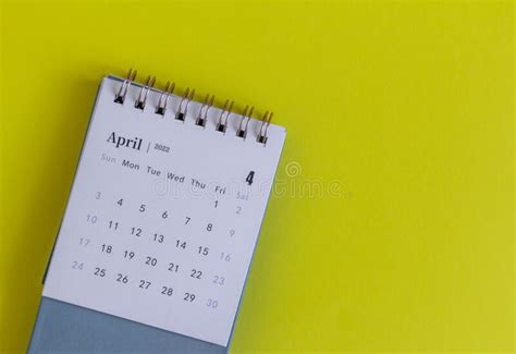 Desktop Calendar For April 2022 For Planning On The Table Stock Photo