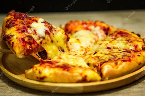 Premium Photo Hot Pizza Slice With Dripping Mozzarella Cheese