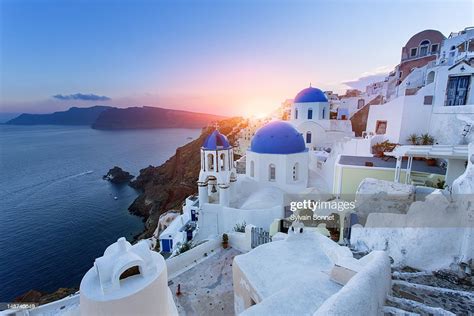 Blue Domed Churches At Sunset Oia Santorini High Res Stock Photo