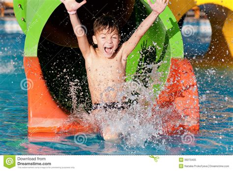 The main problem here is the division between theory and practice: Boy at aqua park stock image. Image of amusement, emotion ...