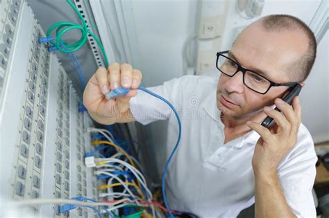 Man Fixing Server Network In Data Center Room Stock Image Image Of