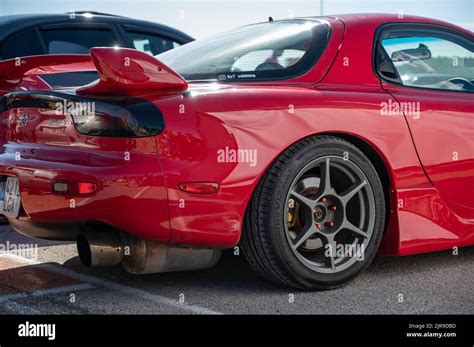 A Rear View Of A Classic Red Japanese Mazda Rx 7 Sports Car Stock Photo