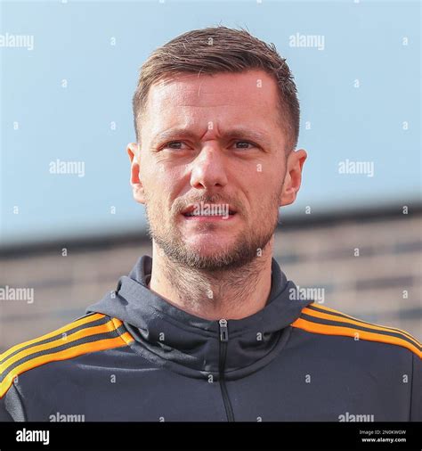 Liam Cooper #6 of Leeds United arrives ahead of the Premier League