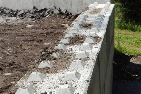 Concrete block retaining wall construction consists of number of phases including excavation, foundation soil preparation, retaining wall base construction, concrete block unit placement, grouting and drainage system installation. Retaining walls used in creative ways to create practical solutions