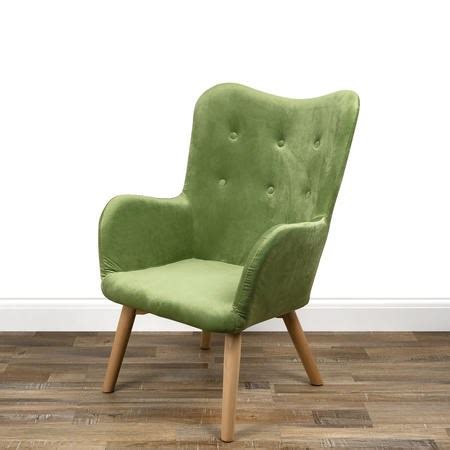 Its design includes button tufting, green velvet upholstery, nailheads trim, winged back and cabriole legs. Green Velvet Wingback Chair - Owen | Furniture123