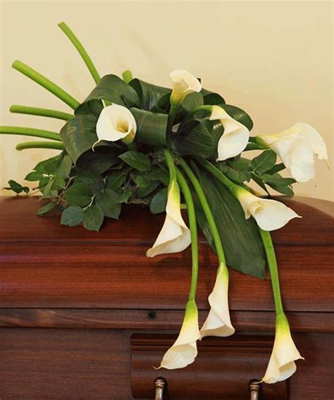 Surprise your loved ones with just because flowers and gifts that'll make their hearts flutter. Calla Lilies Casket Spray | Casket flowers, Funeral floral ...