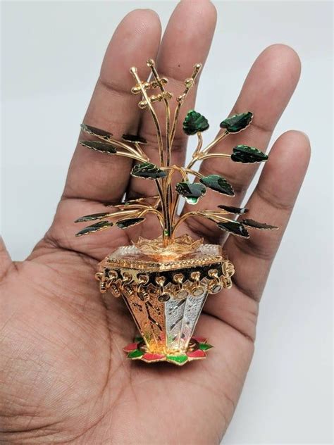 Custom items almost always cannot be returned, so just. Tulasi plant with beautiful enamel - Pure silver gift ...