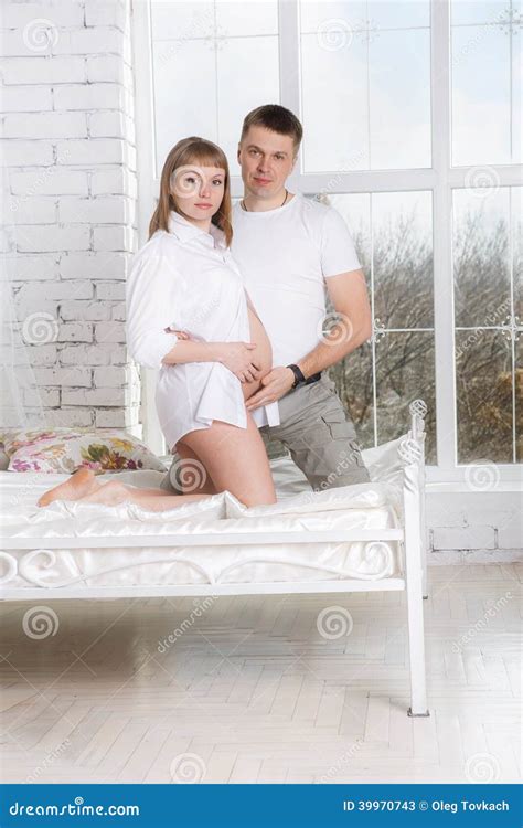 Pregnant Woman With Her Husband At Home Stock Image Image Of Beautiful Casual 39970743