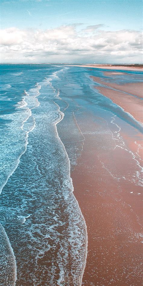 Crystal Blue Waves Coming In Onto A Sandy Beach Coastline Lenovo S5