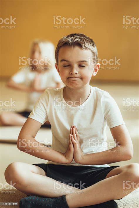 Boy Doing Yoga And Gymnastics In The Gym Stock Photo Download Image