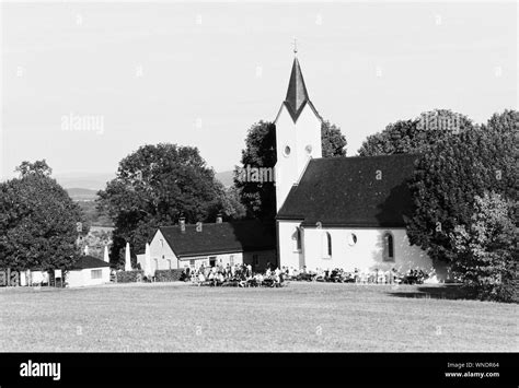 Beautiful Shot Of A Church Near Trees With A Clear Sky In The