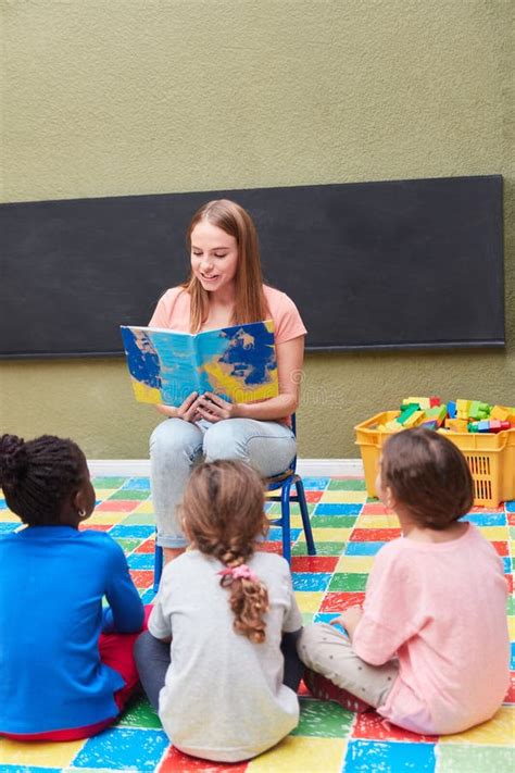 Children In Preschool Listen While Reading Aloud Stock Photo Image Of