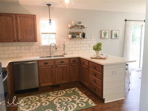 Painting kitchen cabinets is an easy & budget friendly way to update your kitchen! Updating a 90s kitchen - WITHOUT Painting Cabinets!