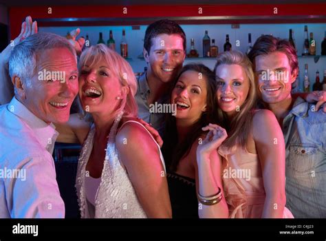 Group Of People Having Fun In Busy Bar Stock Photo Alamy
