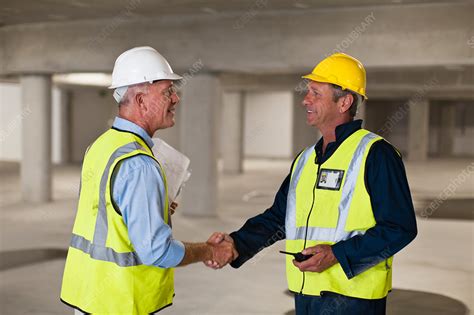 Workers Shaking Hands On Site Stock Image F0053972 Science Photo