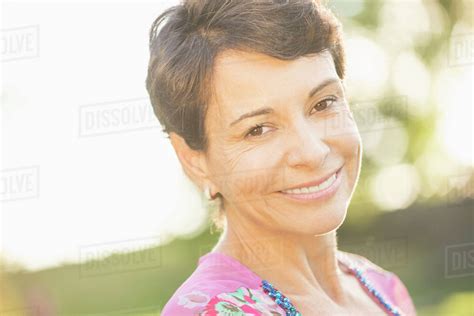 Portrait Of Mature Woman Smiling Stock Photo Dissolve