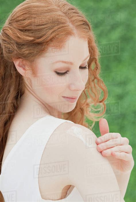 Woman Applying Lotion Stock Photo Dissolve