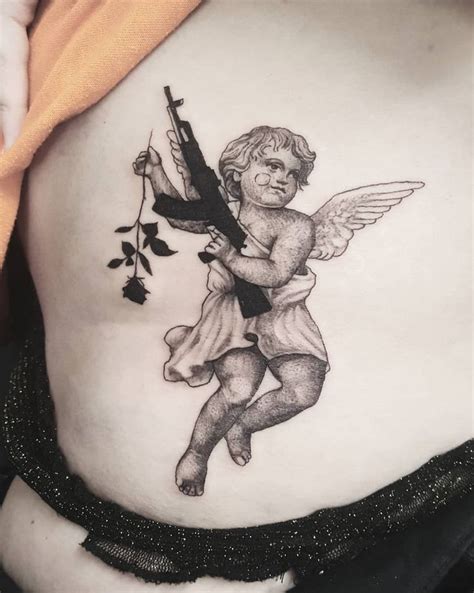 Pin By Carlos Espinoza On Tatuajes Cupid Tattoo Tattoos Tattoo Studio
