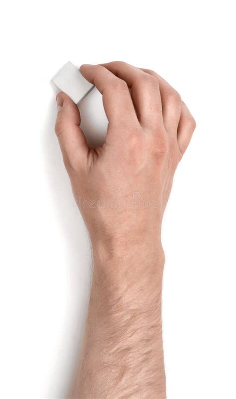 Close Up View Of A Mans Hand Holding An Eraser Isolated On White