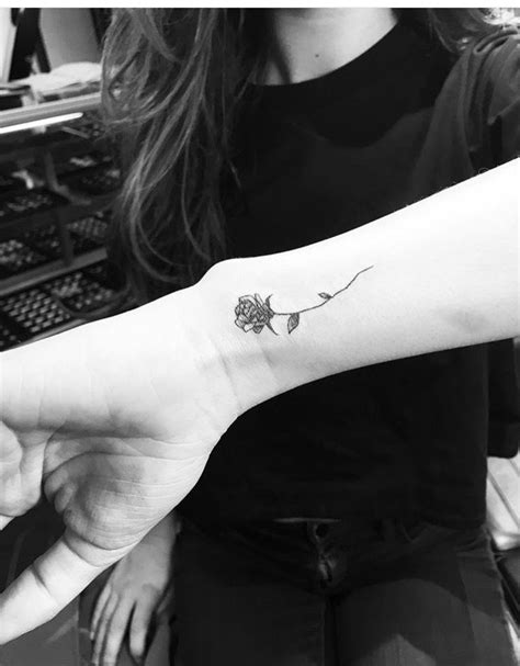 Stunning black rose tattoo on wrist. West 4 tattoo rose wrist tattoo | Rose tattoos on wrist ...