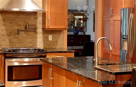 Natural Cherry Cabinets In Kitchen With Black Granite Prep Sink Pot