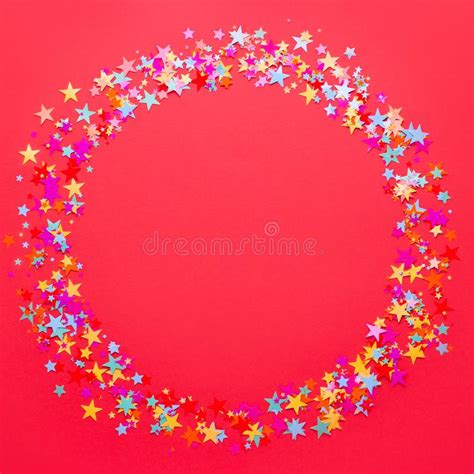 Festive Red Background With Multicolor Star Shape Confetti Copy Space