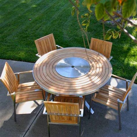 We have every thing you need to be comfortable outdoors. 6 Pc Stainless Steel Teak Round Table dining set - Signature Table with Alzette stacking Chairs ...
