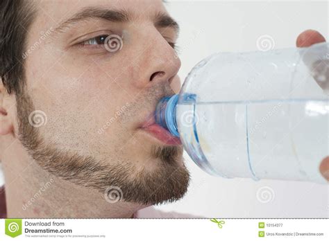 Young Man Drinking Water From A Bottle Stock Image Image